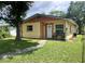 Inviting single-Gathering home with a cozy front porch and a lush green lawn at 772 71St N Ave, St Petersburg, FL 33702