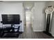 Hallway with modern flooring leading to multiple rooms, featuring fresh paint and neutral decor at 772 71St N Ave, St Petersburg, FL 33702