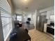 Inviting living room and kitchen featuring stainless steel appliances and plenty of natural light at 772 71St N Ave, St Petersburg, FL 33702
