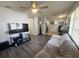 Open-concept living area with modern flooring, ample natural light, and a seamless flow to the kitchen at 772 71St N Ave, St Petersburg, FL 33702