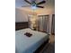 Relaxing bedroom featuring a ceiling fan, accent rug, and a cozy, inviting atmosphere at 9117 41St N Way # 5, Pinellas Park, FL 33782
