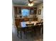 Inviting dining room with a table set for six, featuring built-in cabinetry and a window providing natural light at 9117 41St N Way # 5, Pinellas Park, FL 33782