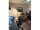 Functional home office setup with desk, office chair, and a comfortable leather recliner at 9117 41St N Way # 5, Pinellas Park, FL 33782