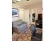 Well-lit home office area with ample space and a large sofa; perfect for productivity and relaxation at 9117 41St N Way # 5, Pinellas Park, FL 33782
