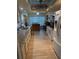 Well-lit kitchen boasts granite counters, white appliances, and a convenient island, offering a blend of style and functionality at 9117 41St N Way # 5, Pinellas Park, FL 33782