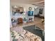 Cozy living room open to the kitchen with a pass-through window and comfortable furnishings, creating a welcoming space at 9117 41St N Way # 5, Pinellas Park, FL 33782