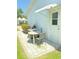 Cozy outdoor patio area with seating and a grill, perfect for relaxing or entertaining in a private setting at 9117 41St N Way # 5, Pinellas Park, FL 33782