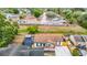 Aerial view showing a tree lined street with single Gathering homes and well-maintained lawns in a Gathering friendly community at 9201 Spy Glass Ct, Tampa, FL 33615