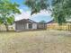 Expansive backyard offering ample space, a screened patio, and privacy fencing at 9201 Spy Glass Ct, Tampa, FL 33615