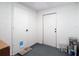 Basement featuring a door with a cat door and a painted floor at 9201 Spy Glass Ct, Tampa, FL 33615