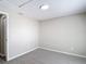 This bedroom has neutral walls, carpet, and a modern ceiling light at 9201 Spy Glass Ct, Tampa, FL 33615
