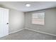 Bedroom featuring neutral paint, carpet, and a window providing natural light at 9201 Spy Glass Ct, Tampa, FL 33615