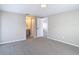 Comfortable bedroom with neutral carpet and access to an ensuite bathroom at 9201 Spy Glass Ct, Tampa, FL 33615
