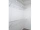 Walk-in closet featuring wire shelving for optimal storage and organization at 9201 Spy Glass Ct, Tampa, FL 33615