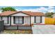 Inviting single-Gathering home with a fresh concrete driveway and well-manicured front yard at 9201 Spy Glass Ct, Tampa, FL 33615