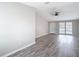 Spacious living room with a ceiling fan and a view of the home's entrance at 9201 Spy Glass Ct, Tampa, FL 33615