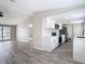 Open-concept living room with modern finishes, leading into a bright and updated kitchen at 9201 Spy Glass Ct, Tampa, FL 33615