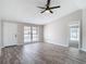 Comfortable living room with stylish floors, a bright window, and convenient access to other rooms at 9201 Spy Glass Ct, Tampa, FL 33615