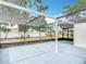 View of the spacious screened-in patio, offering an ideal space for relaxation and entertainment at 9201 Spy Glass Ct, Tampa, FL 33615