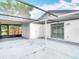 Large screened-in patio with access to storage room and sliding glass door entry, offering privacy and convenience at 9201 Spy Glass Ct, Tampa, FL 33615