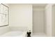 Modern bathroom showcasing a soaking tub, shower, and neutral tile at 9348 Bonita Mar Dr, Parrish, FL 34219