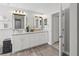 Bright bathroom featuring double sinks, granite counters, and modern finishes at 9723 Rolling Cir, San Antonio, FL 33576