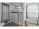Bathroom featuring a glass shower with decor, and a window at 9723 Rolling Cir, San Antonio, FL 33576