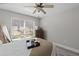 Bedroom featuring a ceiling fan and a window at 9723 Rolling Cir, San Antonio, FL 33576