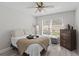 Comfortable bedroom with a large window, dresser, and a cozy bed at 9723 Rolling Cir, San Antonio, FL 33576