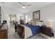 Bright bedroom with modern furnishings and a sliding glass door leading to the patio at 9723 Rolling Cir, San Antonio, FL 33576