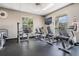 Community gym featuring stationary bikes, tv screen and ceiling fan at 9723 Rolling Cir, San Antonio, FL 33576