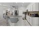 Spacious kitchen with granite countertops, stainless steel appliances, and breakfast bar at 9723 Rolling Cir, San Antonio, FL 33576