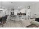 Bright kitchen featuring a breakfast bar with seating, granite countertops and an open floor plan at 9723 Rolling Cir, San Antonio, FL 33576