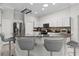 Spacious kitchen with granite countertops, stainless steel appliances, and a breakfast bar at 9723 Rolling Cir, San Antonio, FL 33576
