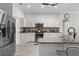 Modern kitchen featuring white cabinetry, granite countertops, and stainless steel appliances at 9723 Rolling Cir, San Antonio, FL 33576
