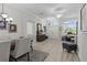 Open-concept living and dining area with wood floors and plenty of natural light at 9723 Rolling Cir, San Antonio, FL 33576