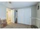 A view of a bedroom featuring a closet and neutral colored walls at 10016 Glen Moor Ln, Port Richey, FL 34668