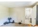 Carpeted room used as a home gym, with access to a half bathroom at 10016 Glen Moor Ln, Port Richey, FL 34668
