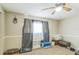 Relaxing bedroom features a ceiling fan and neutral carpet at 10016 Glen Moor Ln, Port Richey, FL 34668