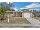 Charming single Gathering home featuring an attached garage and traditional landscaping at 10016 Glen Moor Ln, Port Richey, FL 34668