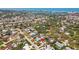 An aerial view showing the neighborhood, proximity to the beach and bay, and location of the home at 10448 Hetrick W Cir, Largo, FL 33774