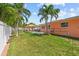 The spacious backyard includes a pool and tropical landscaping, creating a private oasis at 10448 Hetrick W Cir, Largo, FL 33774