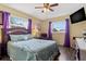 Warm bedroom featuring a bed, bedside tables, and warm lighting offering a cozy atmosphere at 10448 Hetrick W Cir, Largo, FL 33774