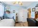 Comfortable bedroom featuring a wrought iron bed, decorative lighting, and a closet at 10448 Hetrick W Cir, Largo, FL 33774