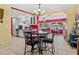 Open concept view of kitchen, dining room, and breakfast nook with elegant chandelier at 10448 Hetrick W Cir, Largo, FL 33774