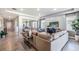 Spacious living room with open floor plan, large windows, and modern decor at 10645 Bridgegate Heights Loop, San Antonio, FL 33576