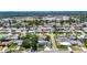An aerial view of a charming neighborhood with lush green trees at 12933 90Th Ave, Seminole, FL 33776