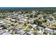An aerial view of a charming neighborhood with lush green trees at 12933 90Th Ave, Seminole, FL 33776