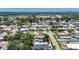 Aerial view of a neighborhood featuring single-Gathering homes and lush landscaping and a lake at 12933 90Th Ave, Seminole, FL 33776