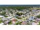 An aerial view of a charming neighborhood with lush green trees at 12933 90Th Ave, Seminole, FL 33776